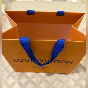 Louis Vuitton Vibrant Orange Bag with Bold Blue Handles